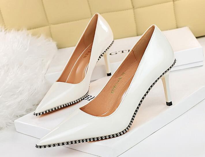 European fashion sexy stiletto high-heeled patent leather shallow mouth pointed metal beads rivet...